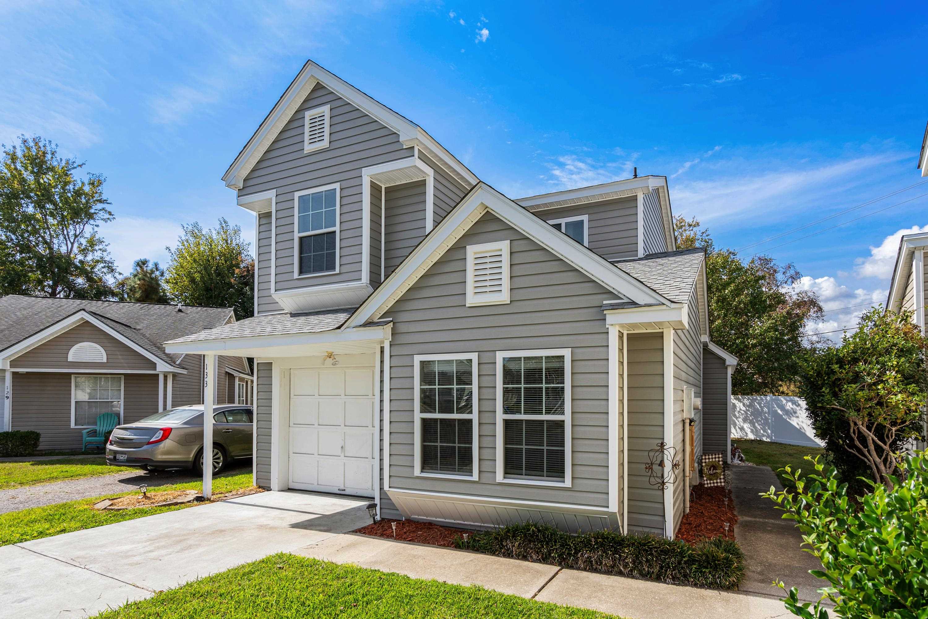 View of property featuring a garage