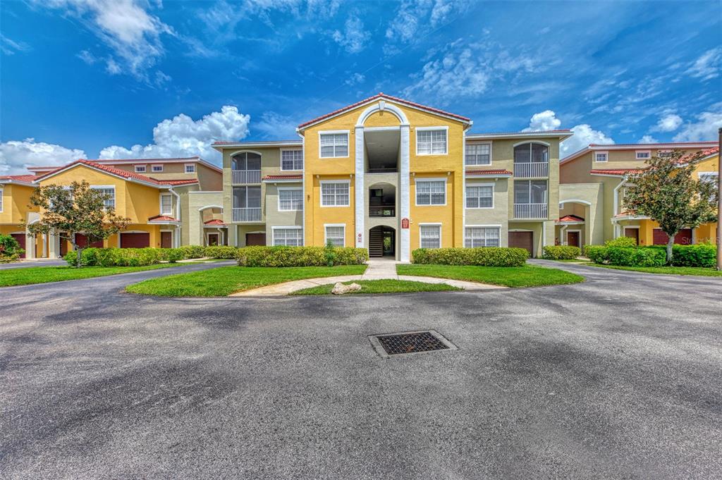 a view of a building with a yard