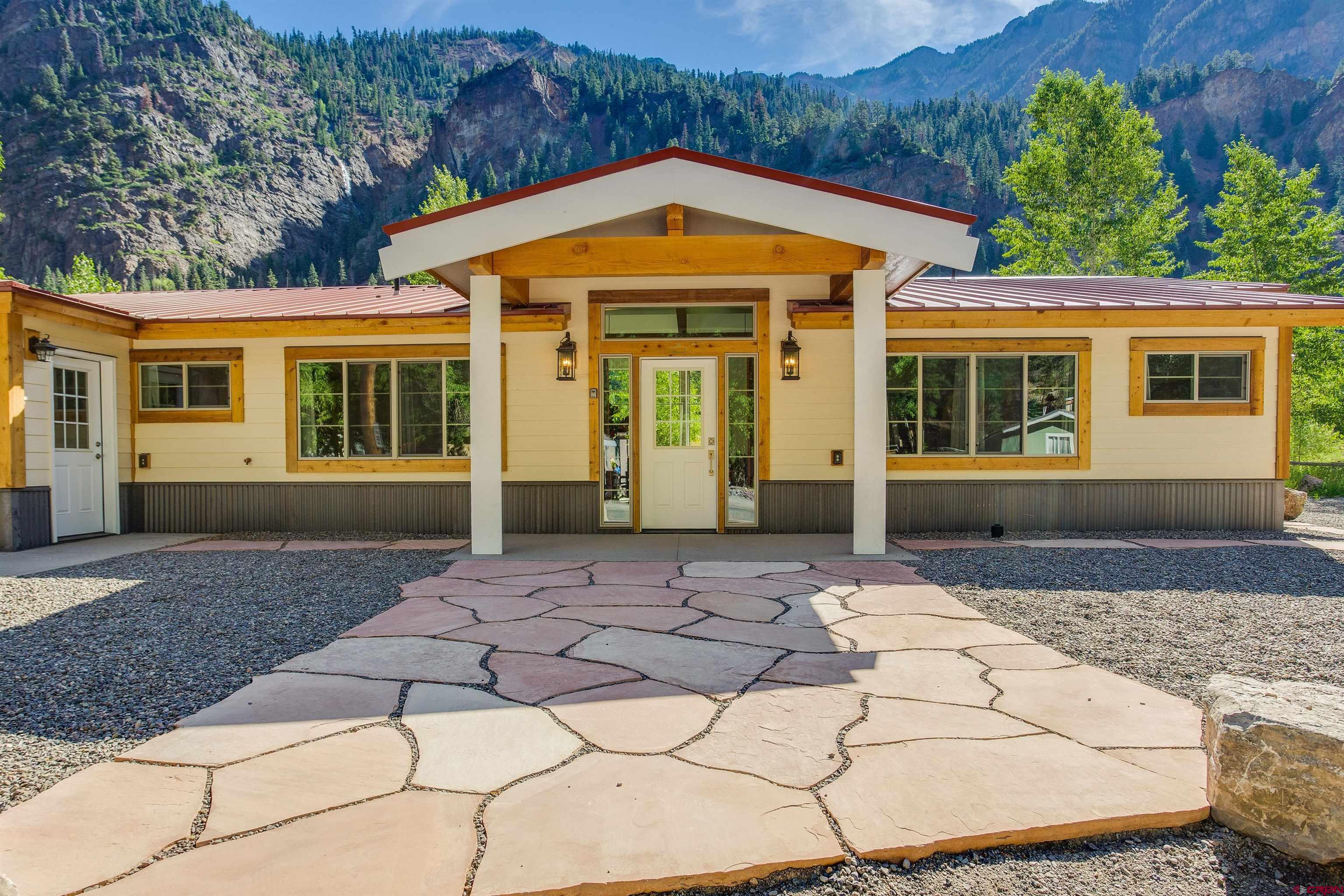 front view of a house with a yard