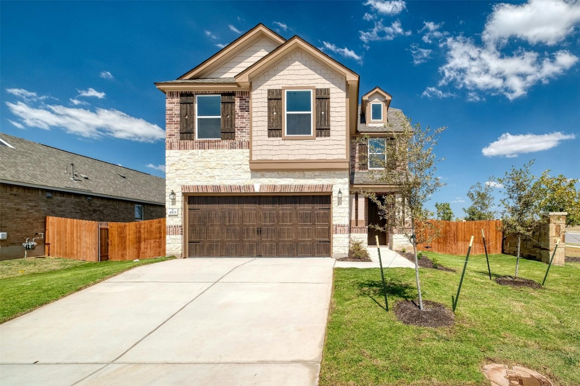 a front view of house with a yard