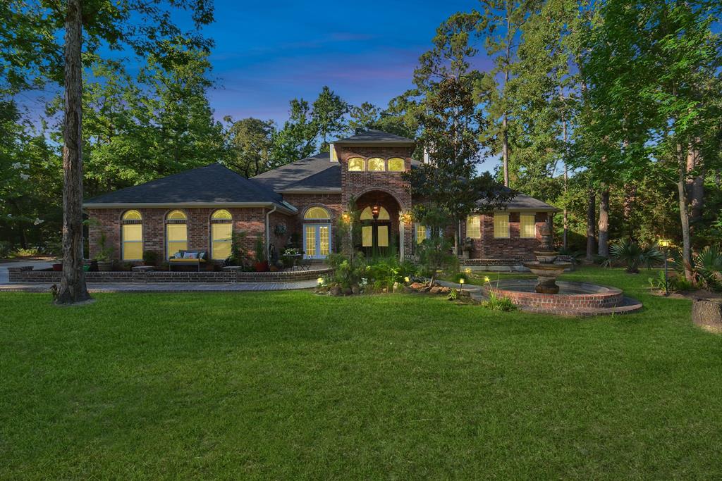 a front view of a house with swimming pool having outdoor seating