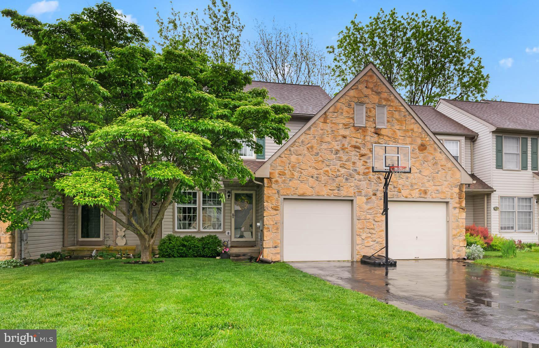 front view of a house with a yard