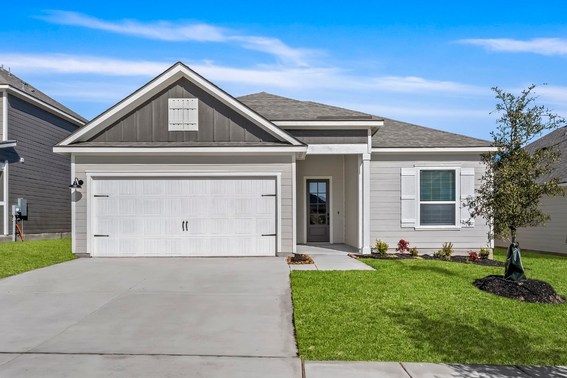 front view of a house with a yard