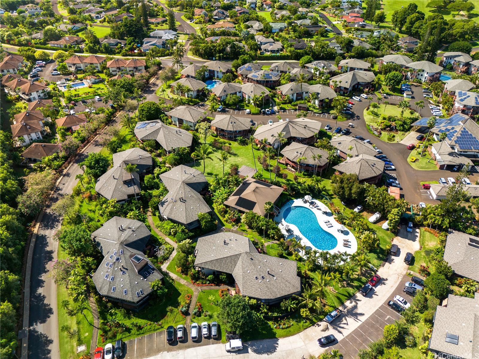 an aerial view of residential house with outdoor space and parking