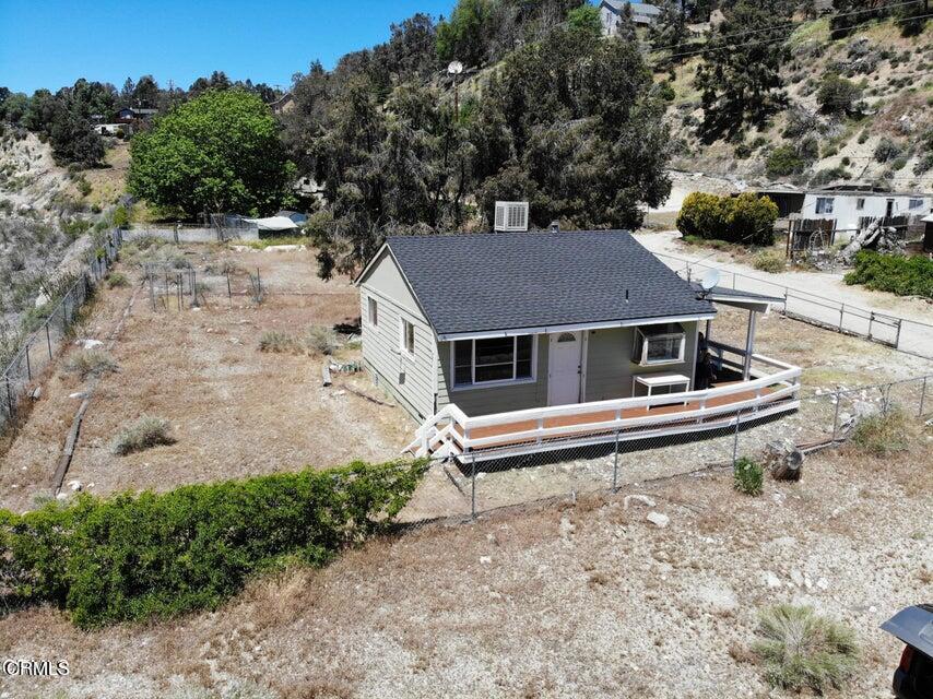 a aerial view of a house with a yard