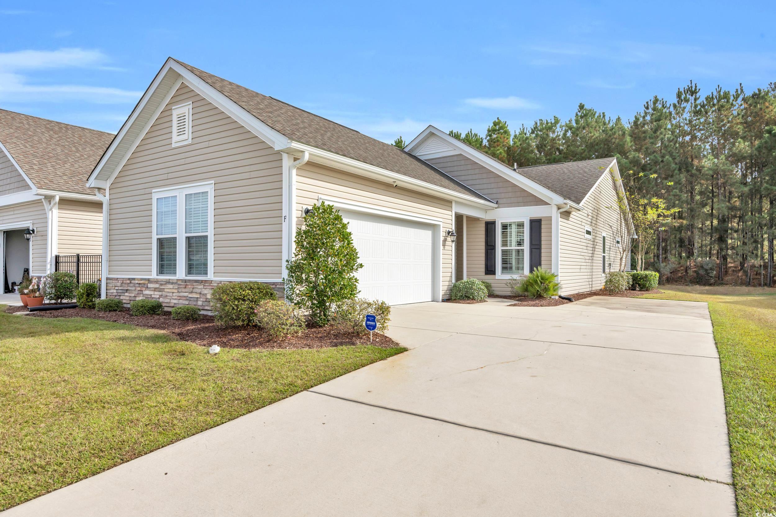 View of front of home featuring a front lawn and a