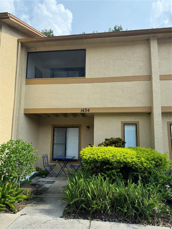 a front view of a house with garage