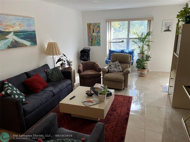 a living room with furniture and a window