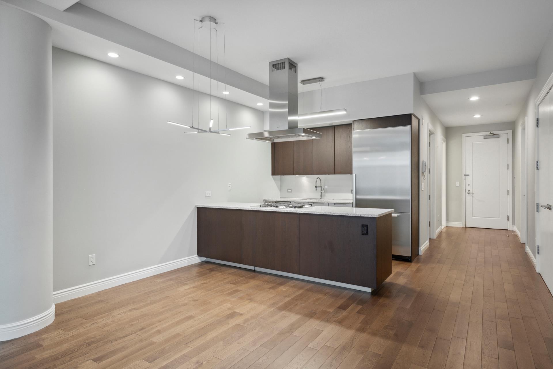 a kitchen with stainless steel appliances a refrigerator and a sink