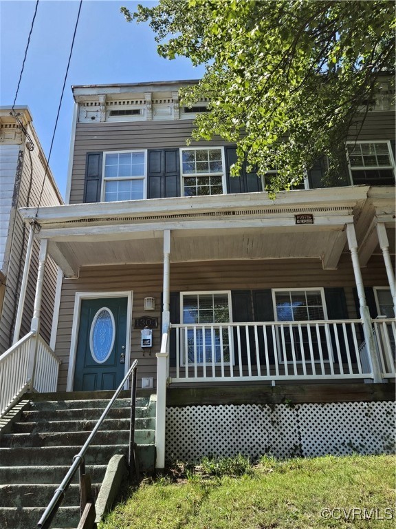 a view of a house with a wooden deck