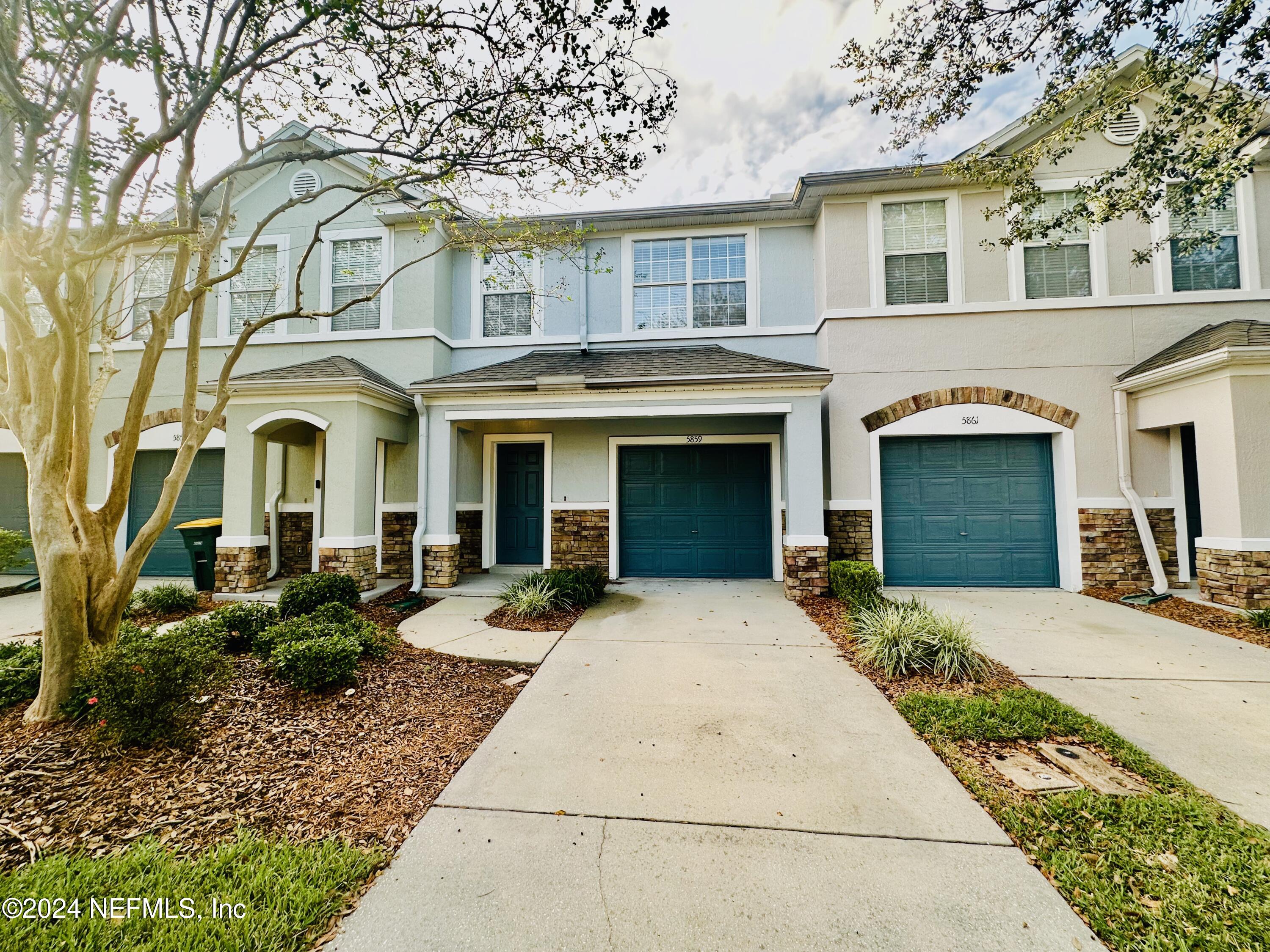 front view of a house with a yard