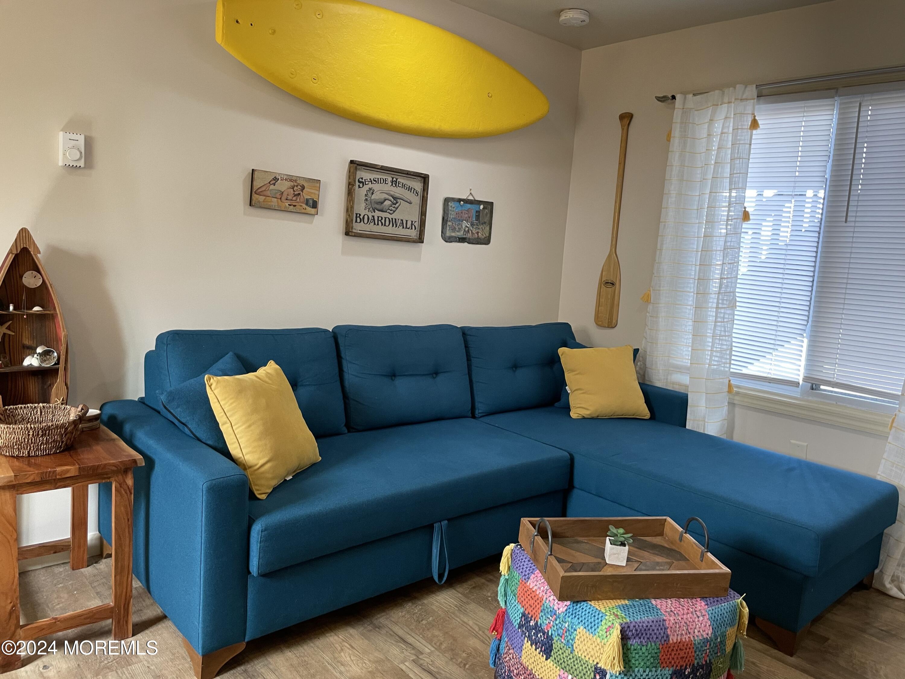 a living room with furniture and a window