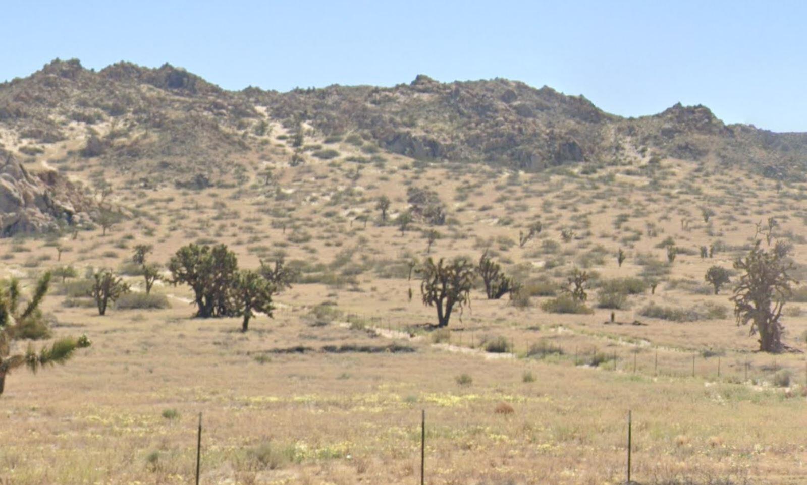 a view of mountain view with mountains in the background