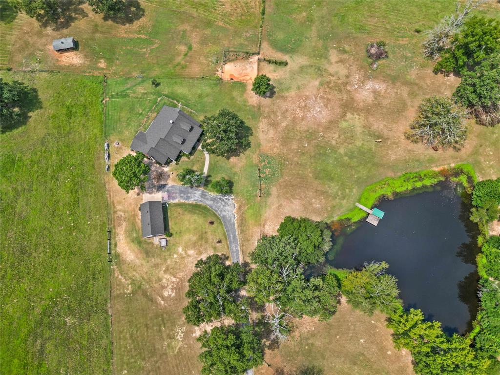 an aerial view of residential house with outdoor space