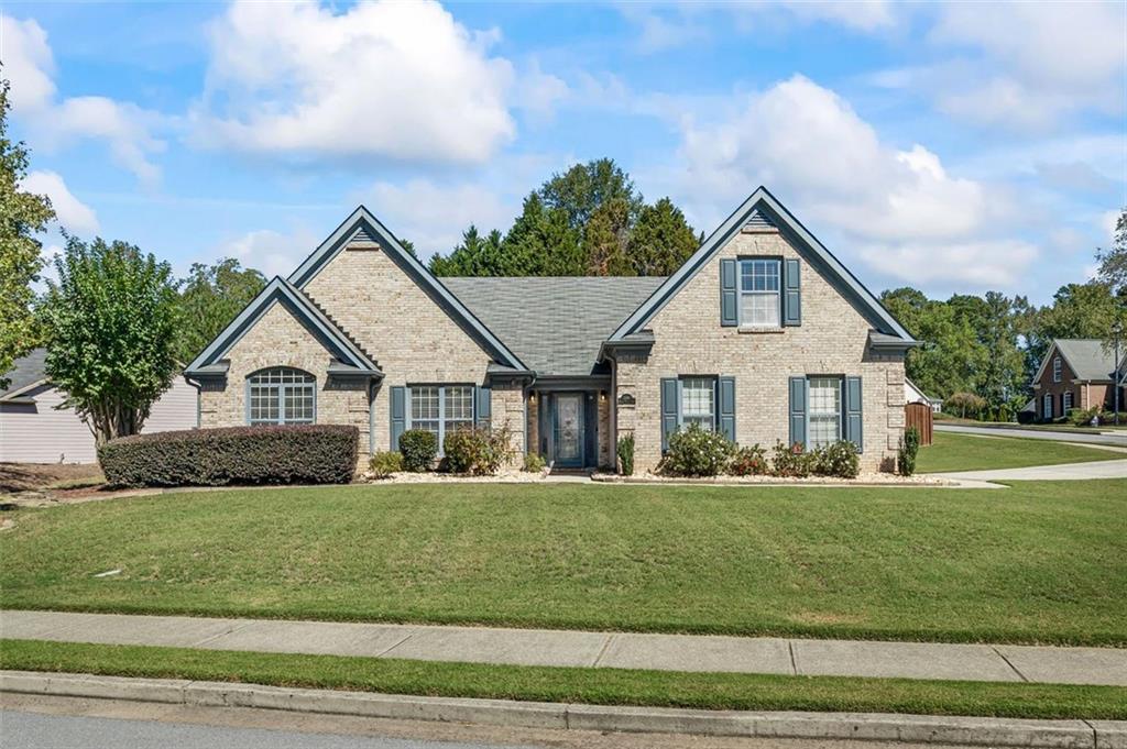 a front view of a house with a yard