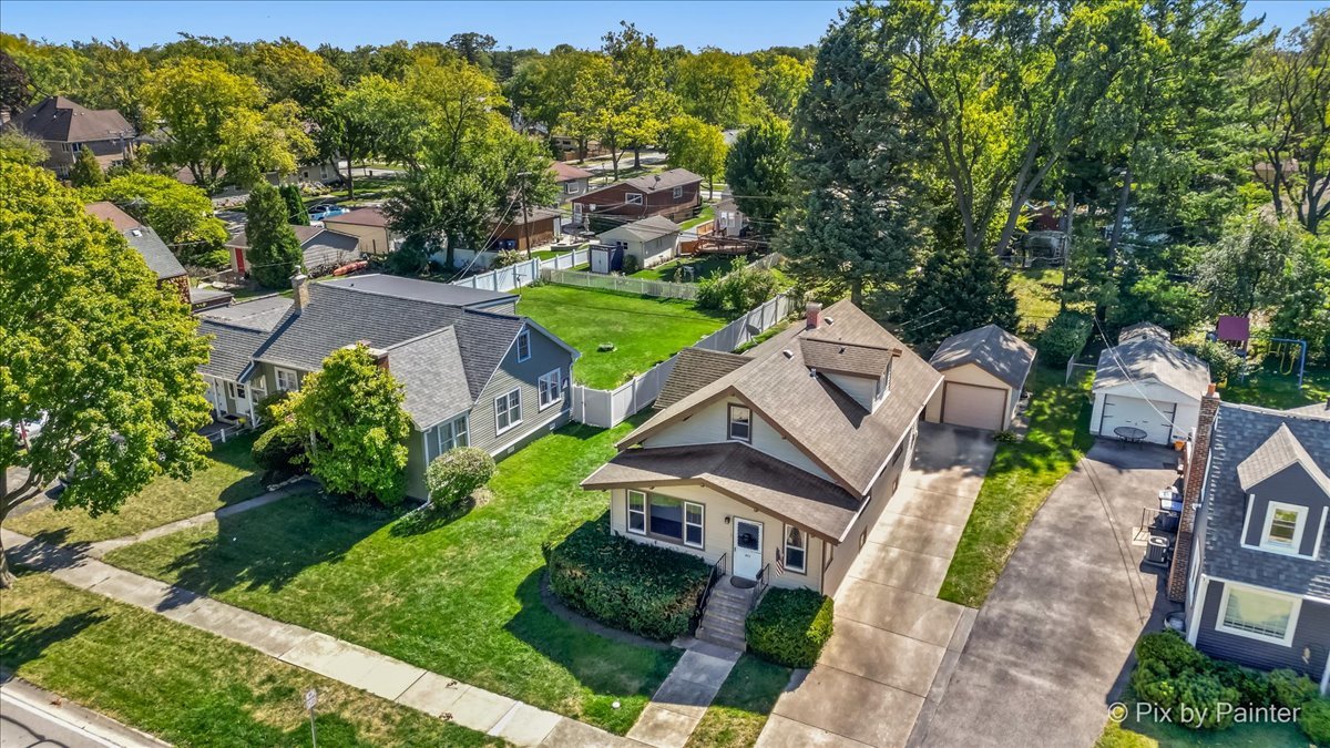 an aerial view of a house with a garden