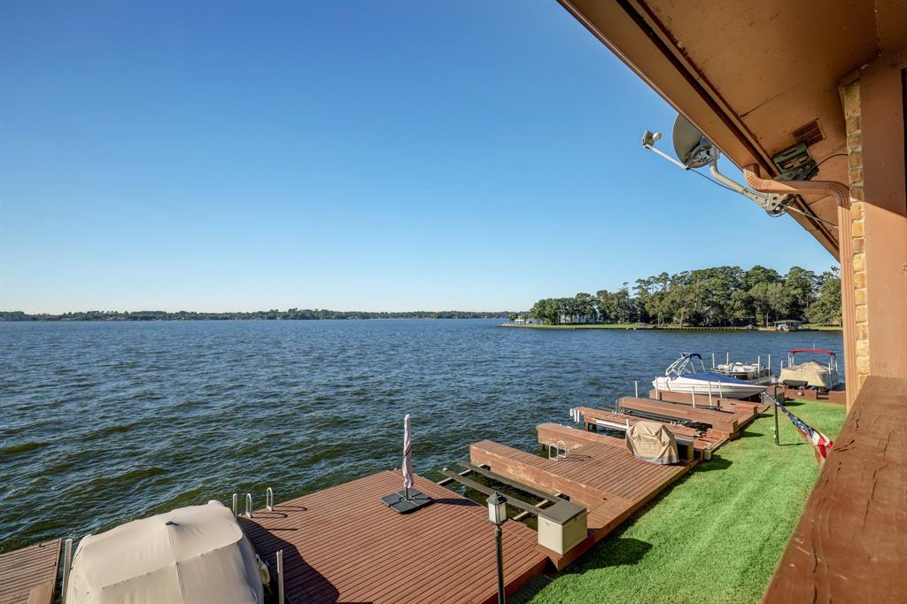 a view of a lake with furniture