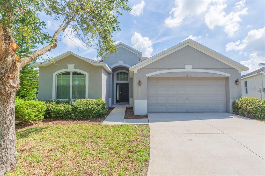 front view of a house with a yard