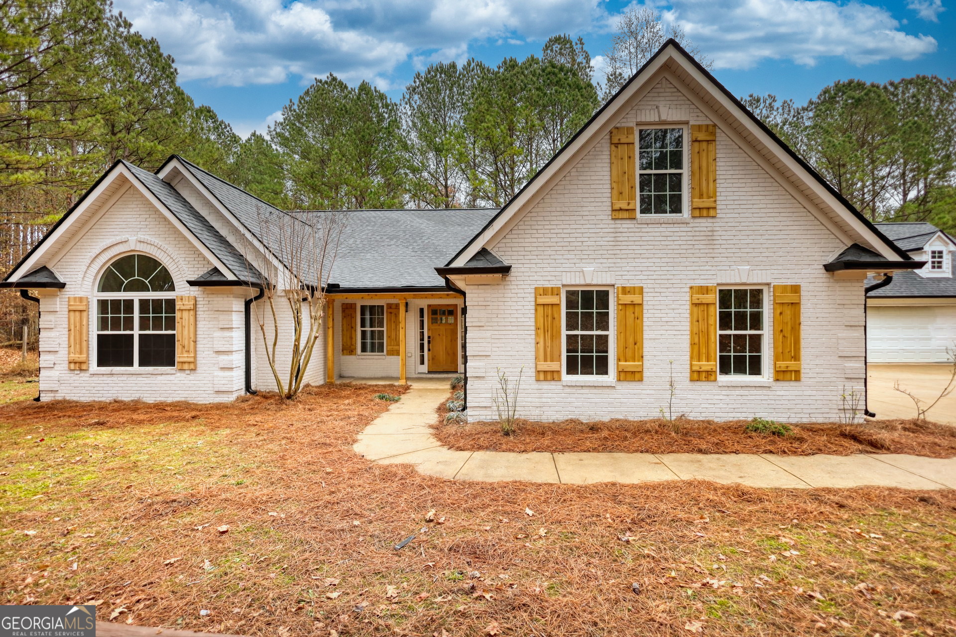 a front view of a house with a yard