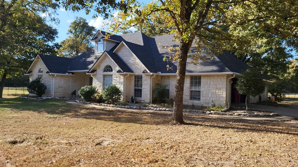 a front view of a house with yard