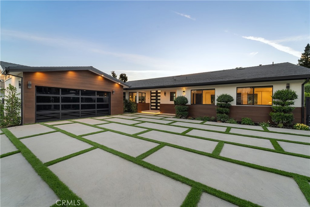 front view of a house with a small yard