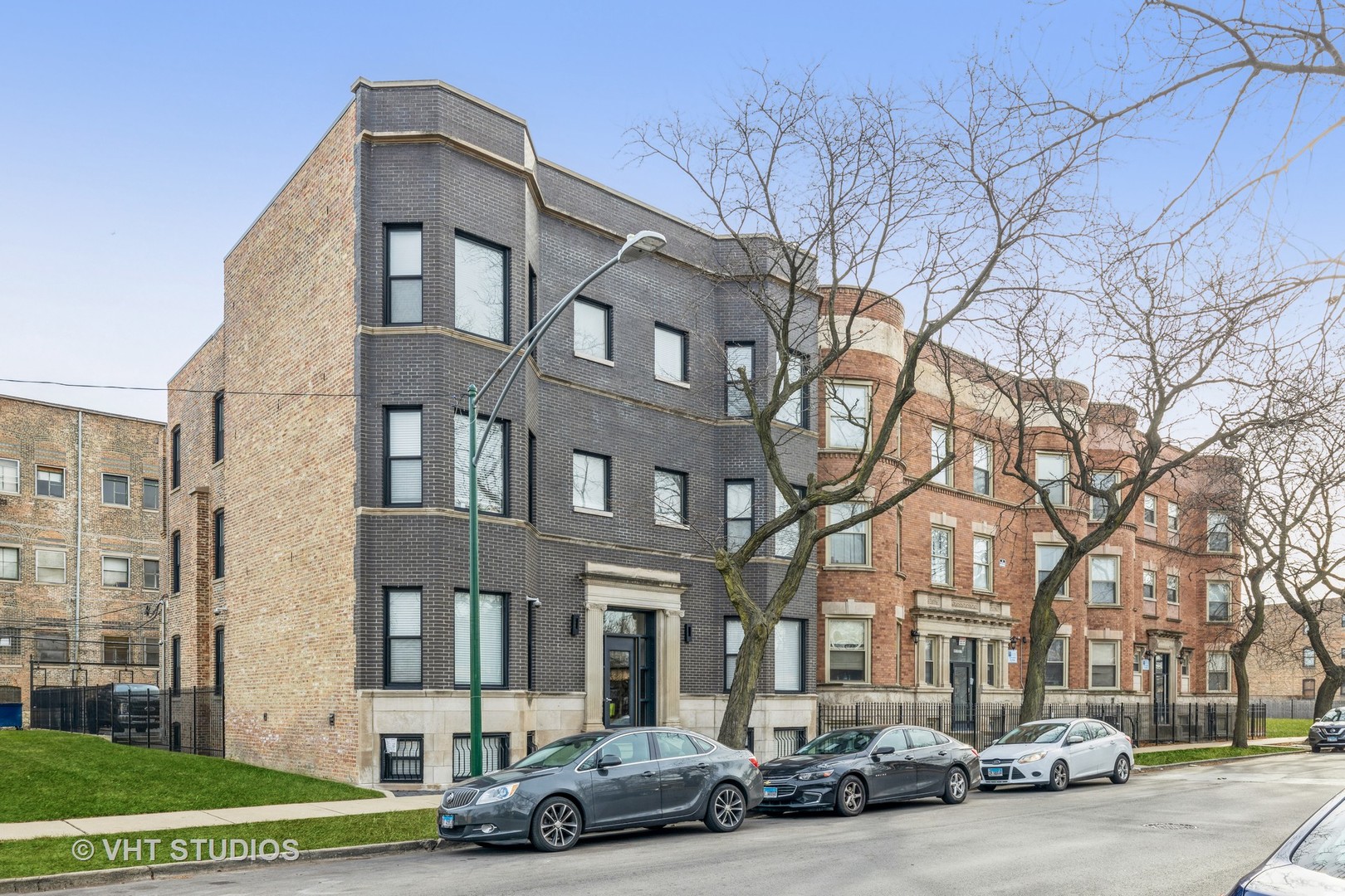 a car parked in front of a brick building