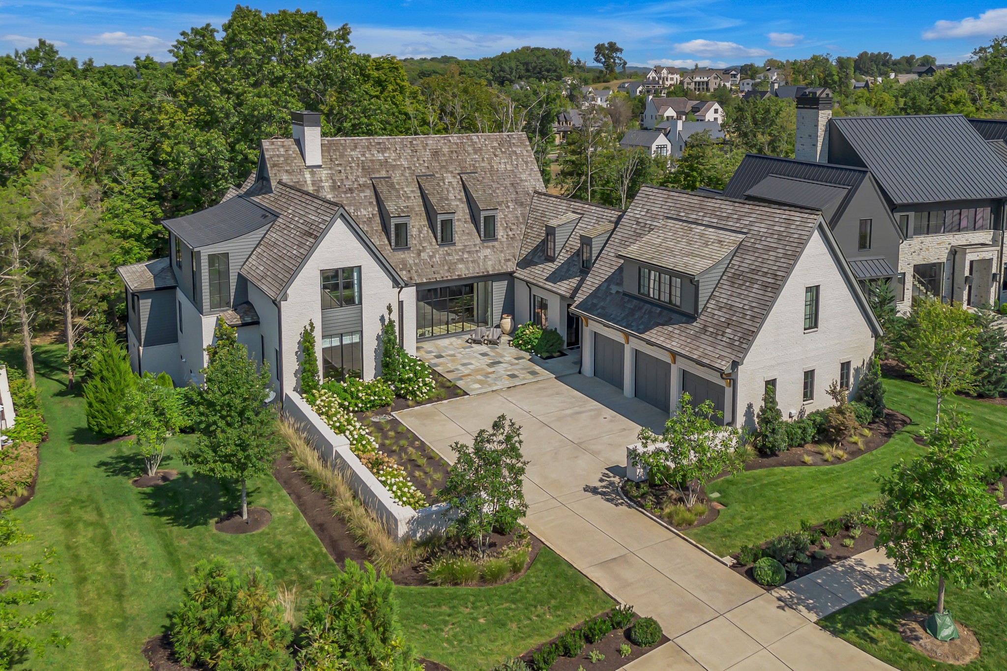 an aerial view of a house with a garden