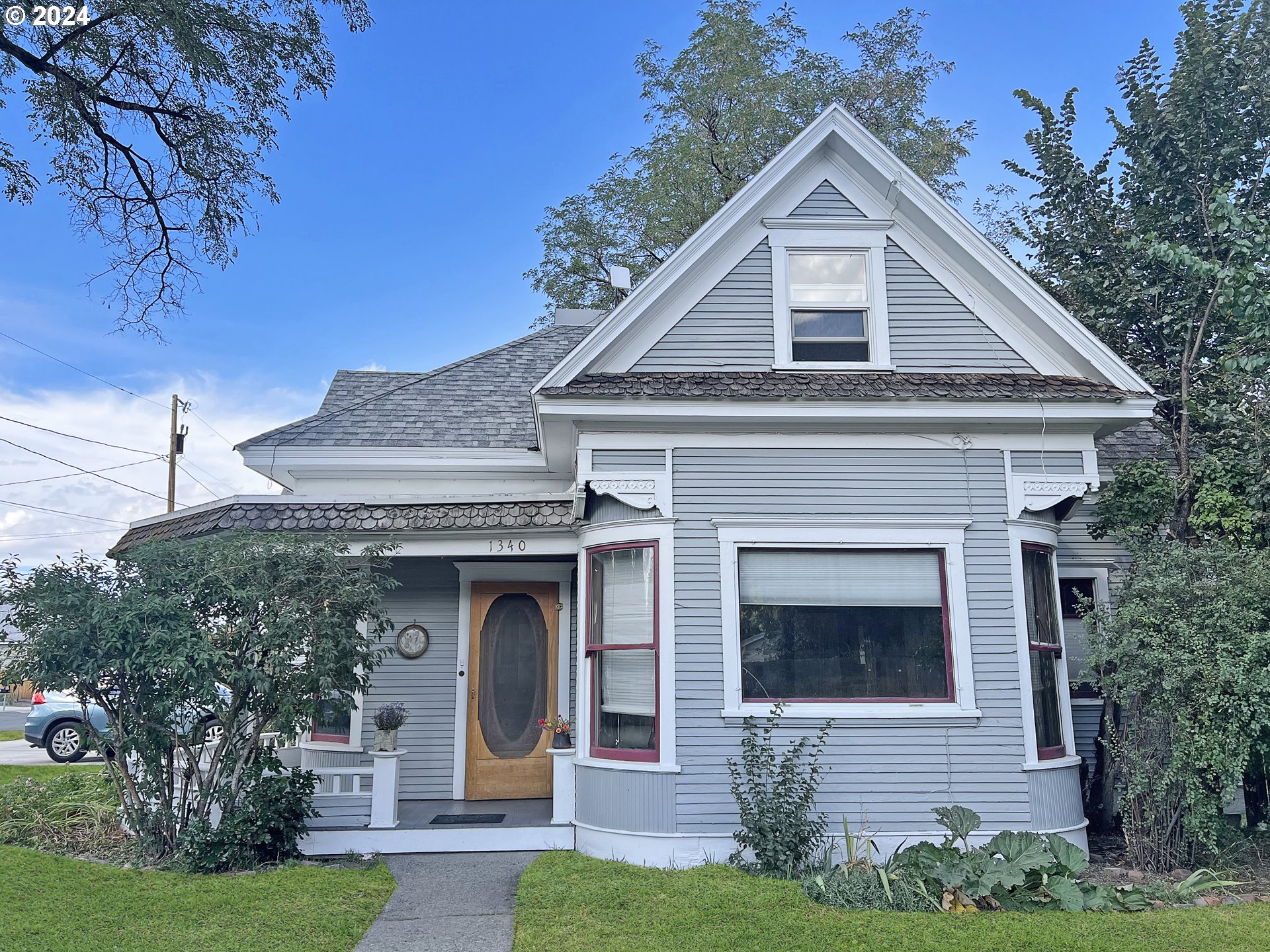 a front view of a house with garden