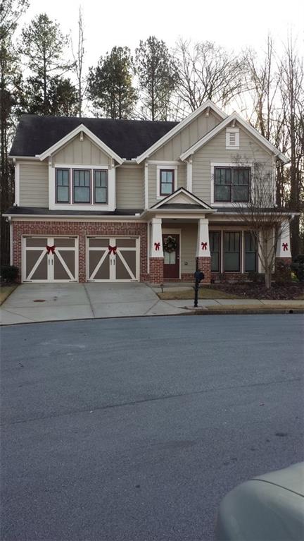 a front view of a house with large windows