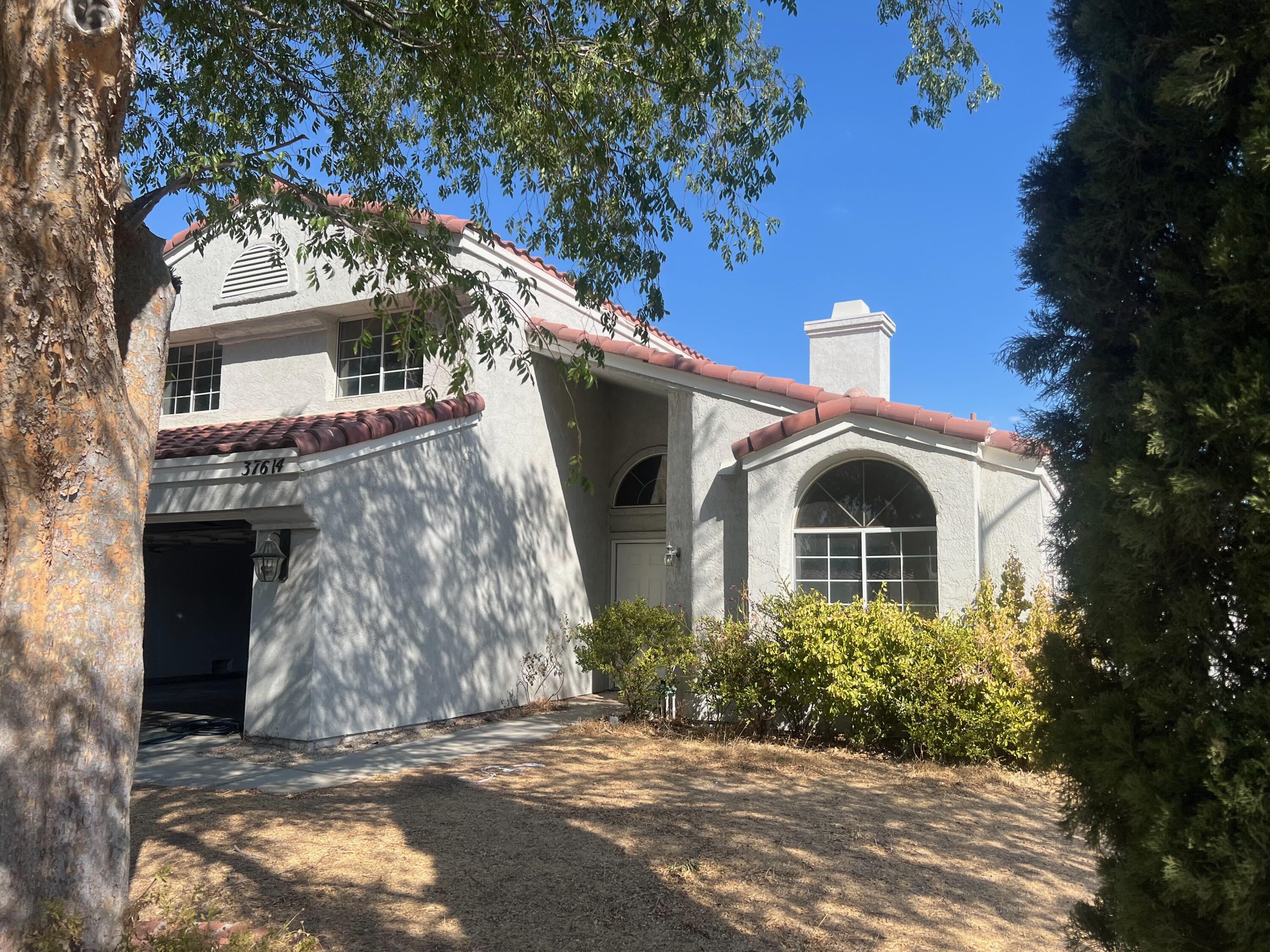 a front view of a house with yard