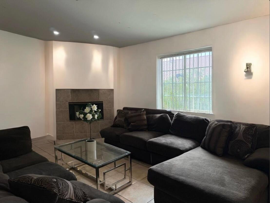 a living room with furniture and a fireplace