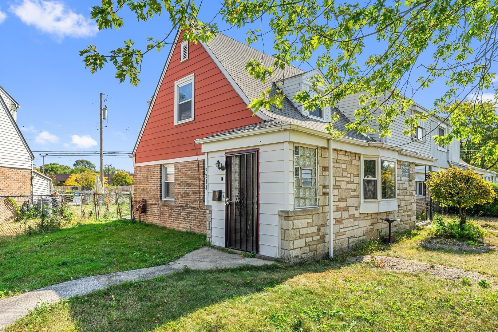 a view of a house with a yard