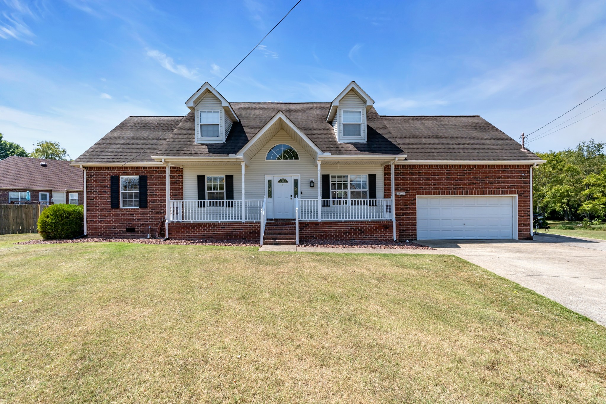 front view of a house with a small yard