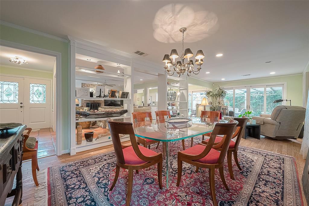 Dining room view, with display shelves middle home, showing openness of 1st floor.