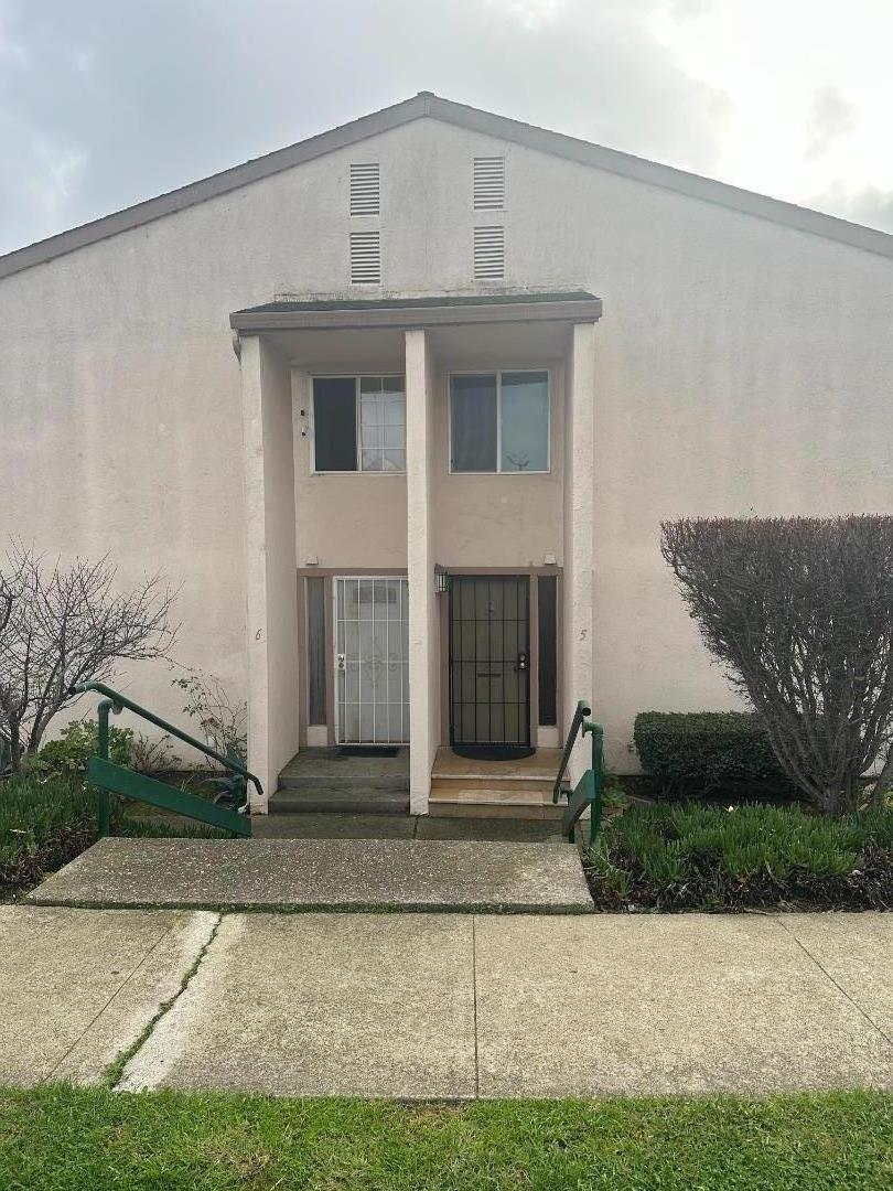 a front view of a house with garage