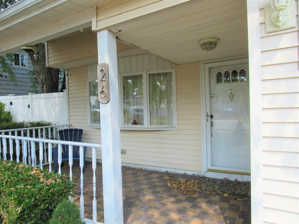 a view of a house with a small yard