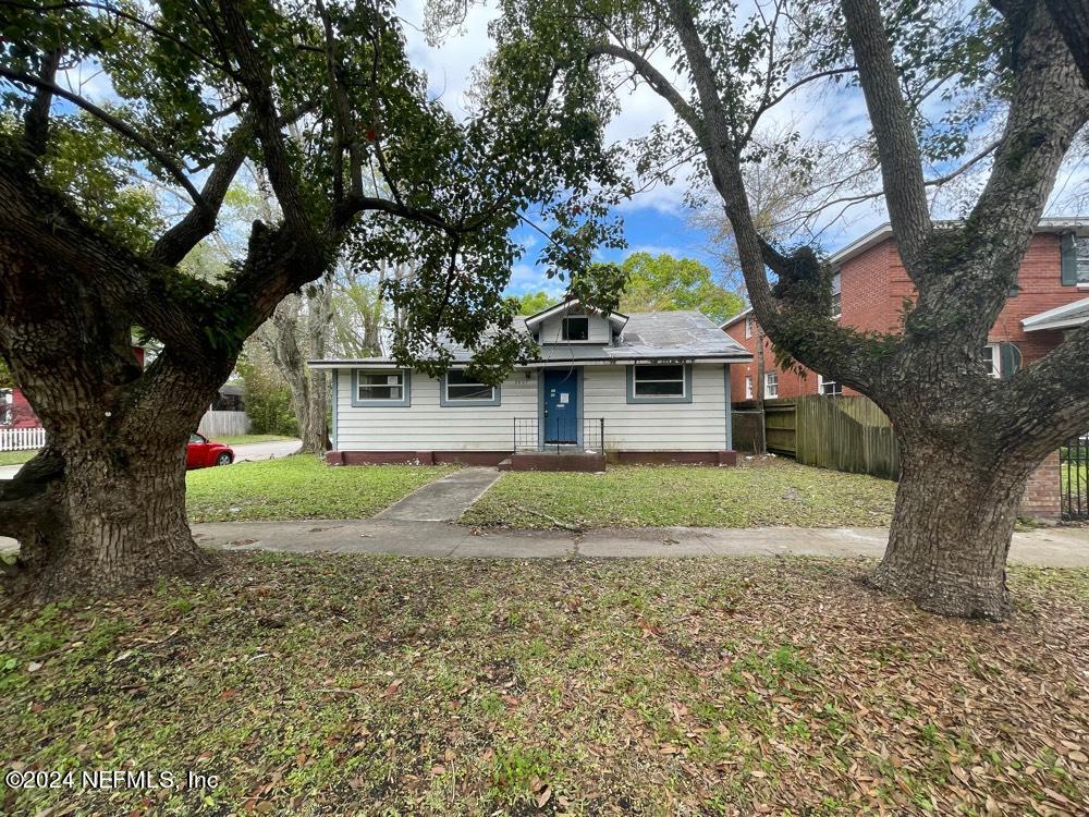 a house that has tree in front of it