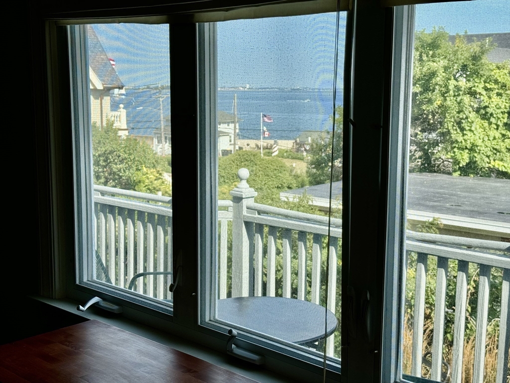 a view of a porch with a floor to ceiling window