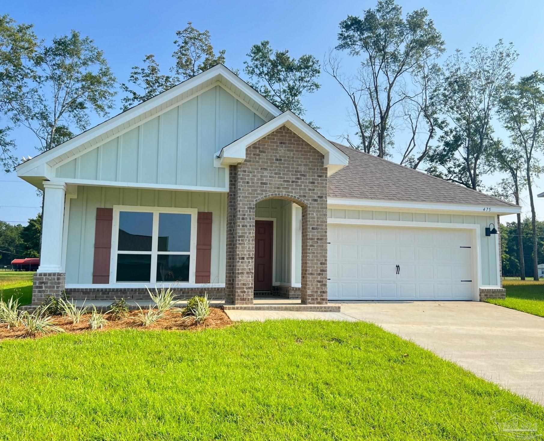 a front view of a house with yard