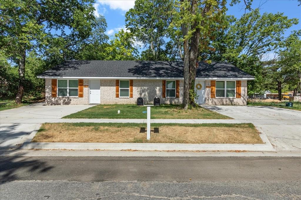 front view of house with a small yard