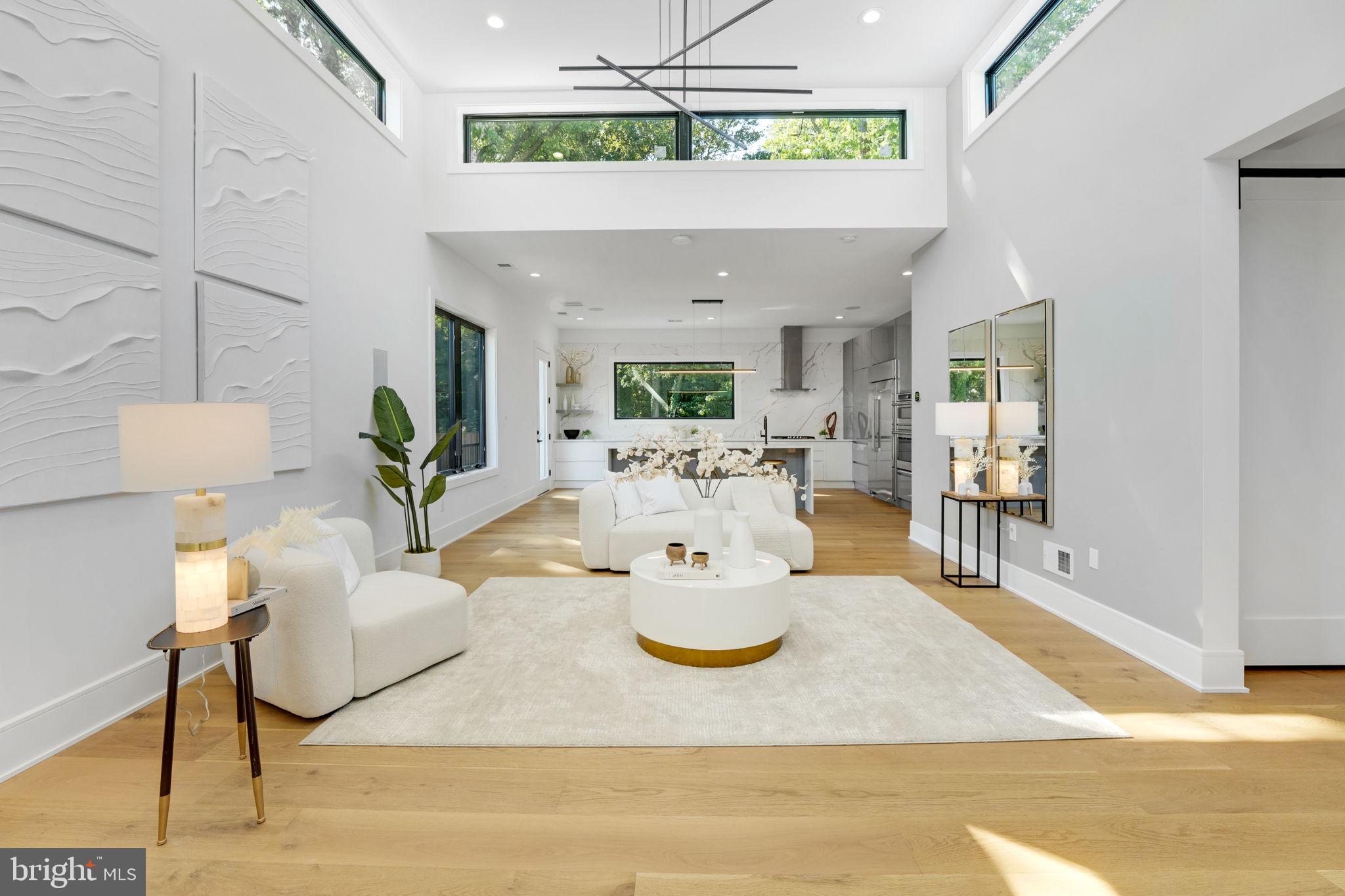 a dining room with furniture and a chandelier