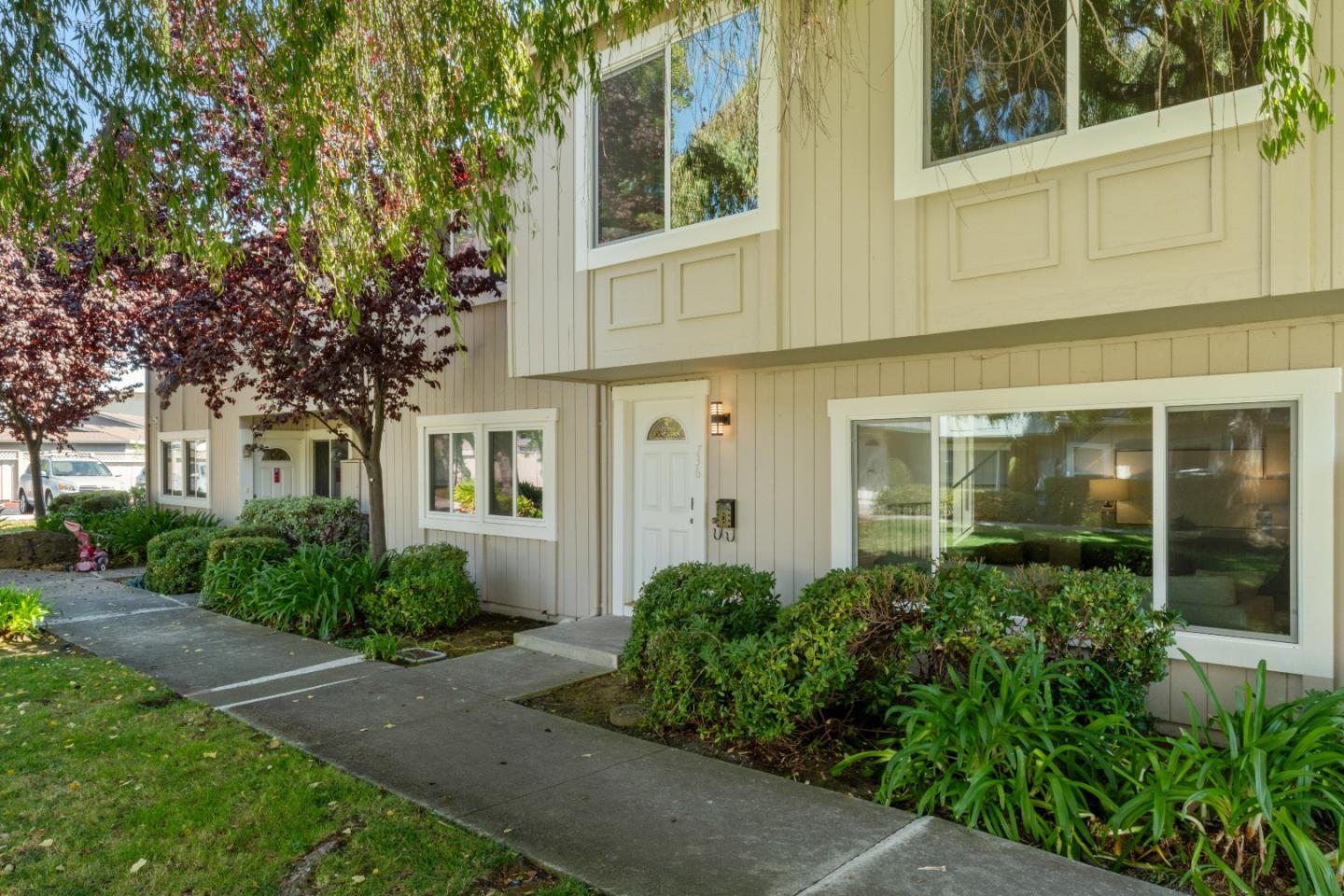 front view of a house with a yard