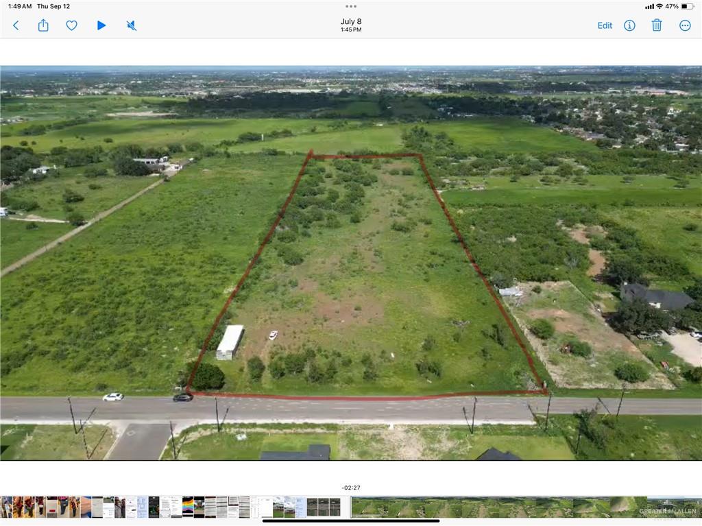 Birds eye view of property with a rural view