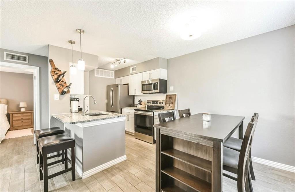 a open kitchen with a table and chairs in it