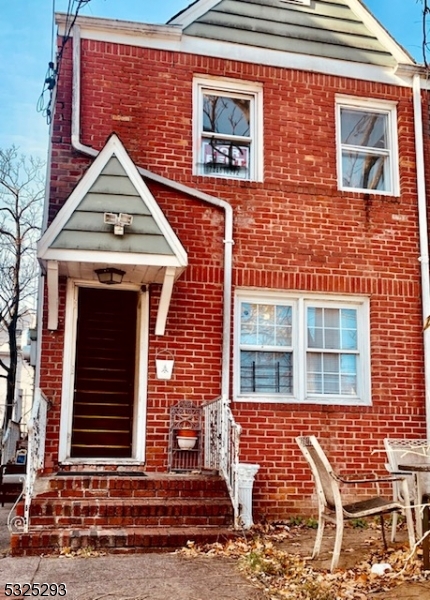 a view of a brick house with windows