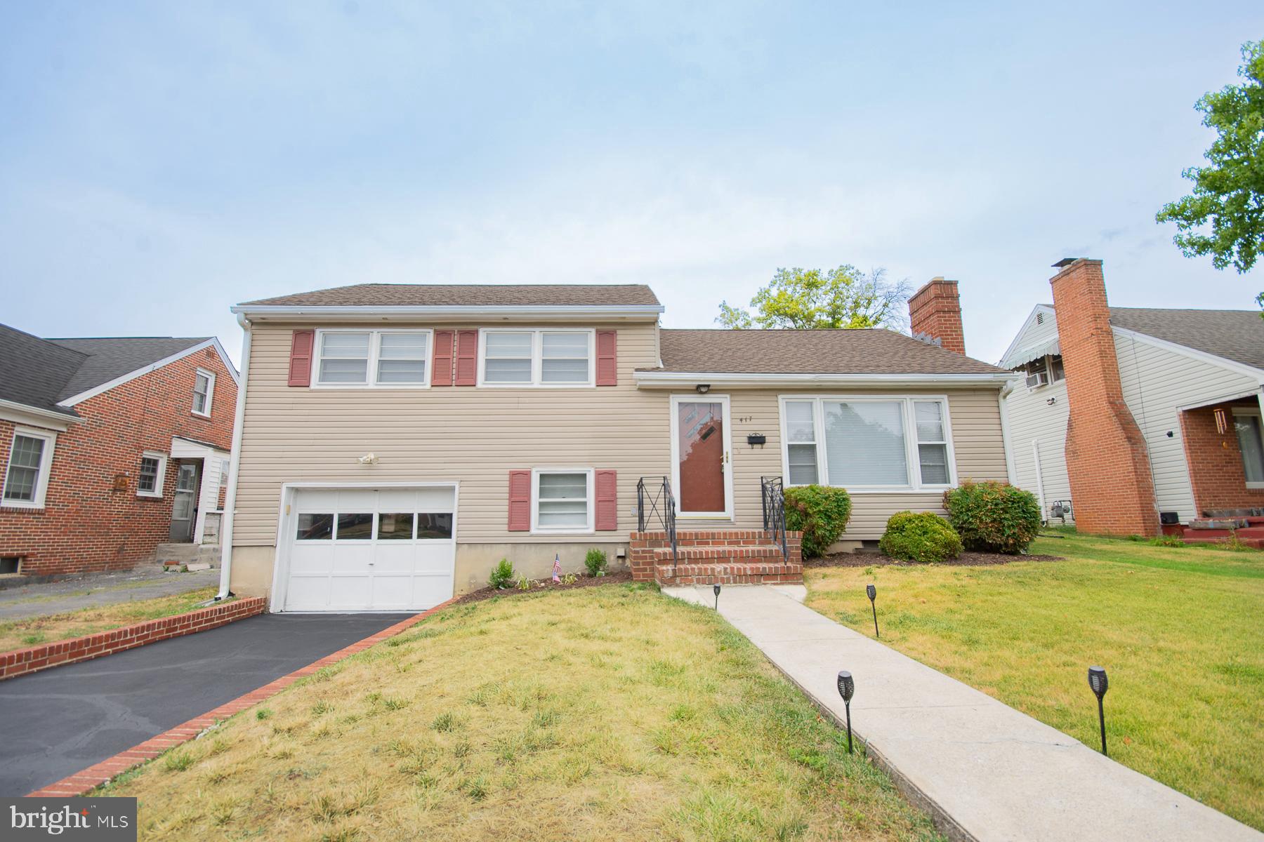 front view of a house with a yard