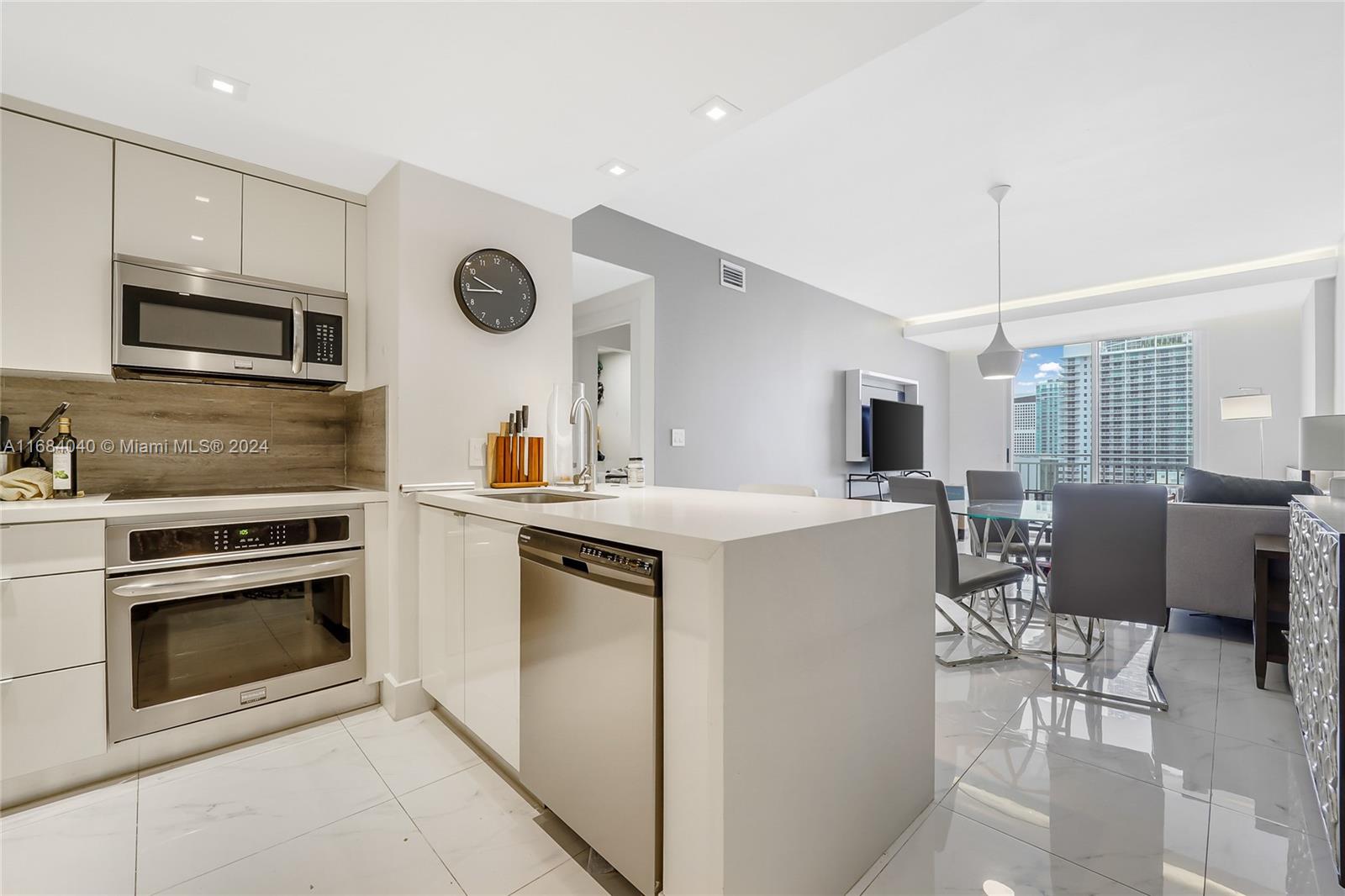 a kitchen with a stove cabinets and microwave