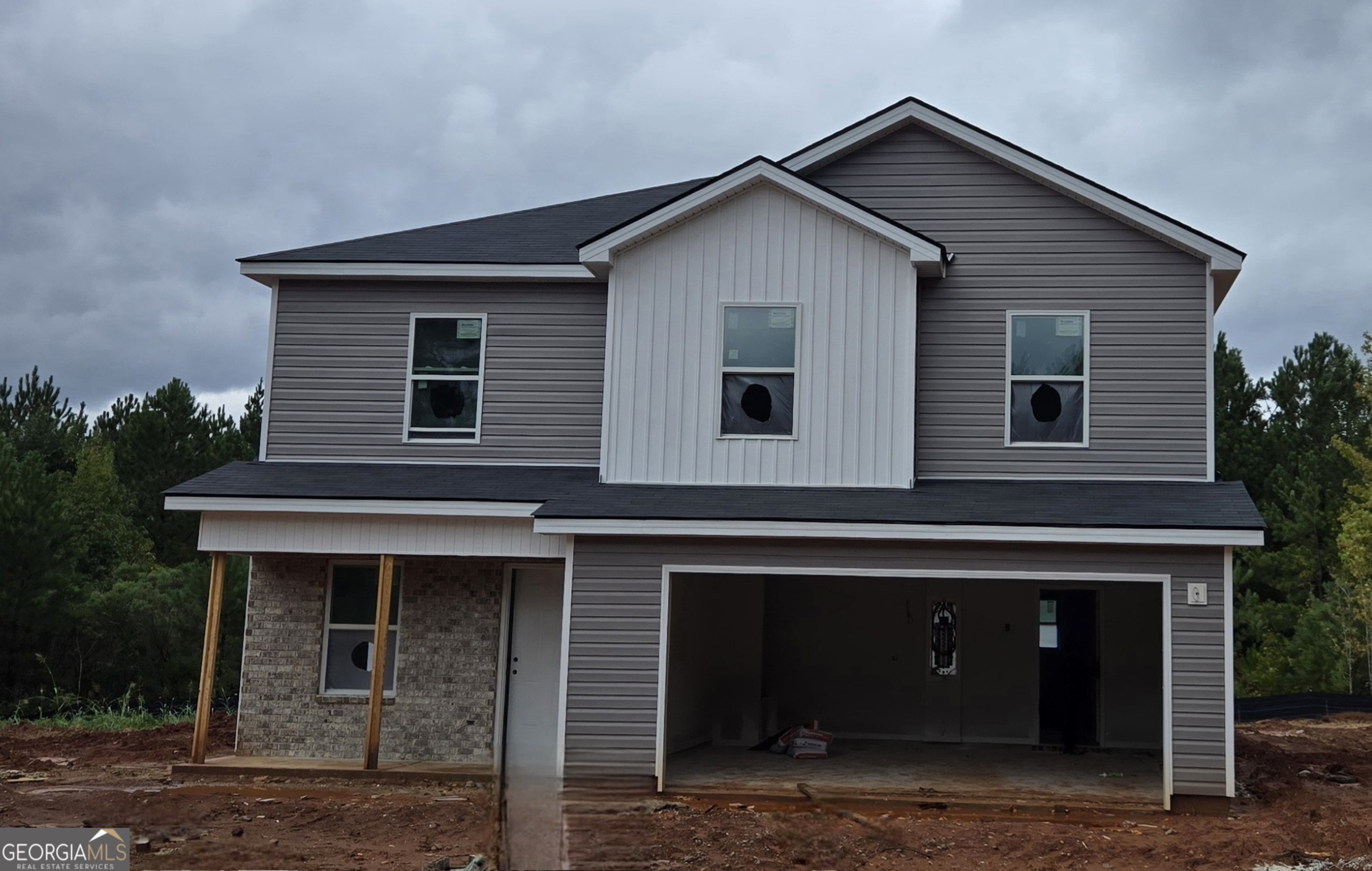 a front view of a house with garage