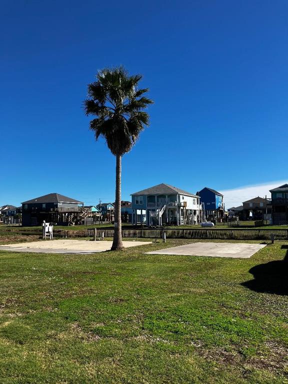 a view of a water fountain and a big yard