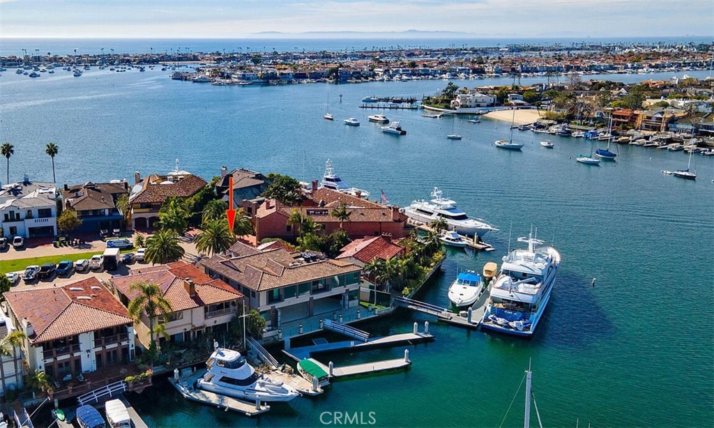 an aerial view of a house with a ocean view